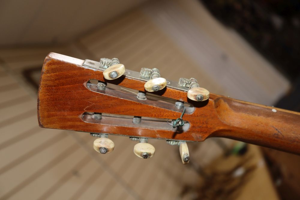 A six string banjo, length 94cm
